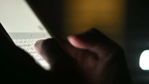 Close-up of female hands typing text on the phone at night. Chatting, Internet Stock Footage 217687994