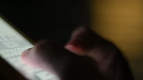 Close-up of female hands typing text on the phone at night. Chatting, Internet Stock Footage 217688045