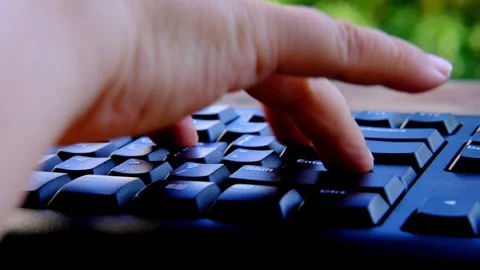 Close-up female hands typing text on black keyboard, office environment, co.. Stock Footage 270722554
