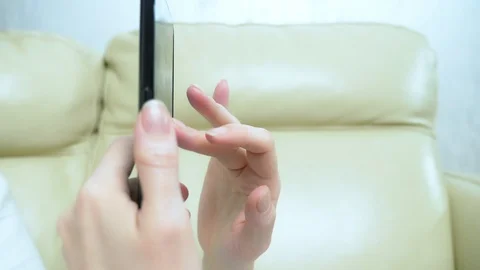 Close-up. female hands using applications on a mobile touchscreen smartphone Stock Footage 119128111