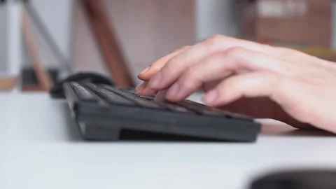 Close-up of female hands using a computer keyboard at the desktop 스톡 동영상 152769907