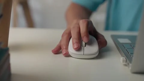 Close-up of female hands using computer mouse working on a laptop. Stock Footage 340307085