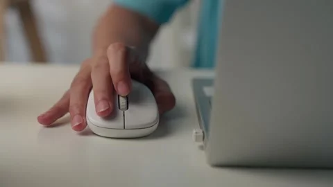 Close-up of female hands using computer mouse working on a laptop. Stock Footage 340307086