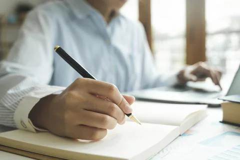 Close up female hands using computer laptop for online working. Stock Photos