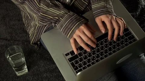 Close up of female hands using laptop sitting down on the floor at home Stock Footage 72525439