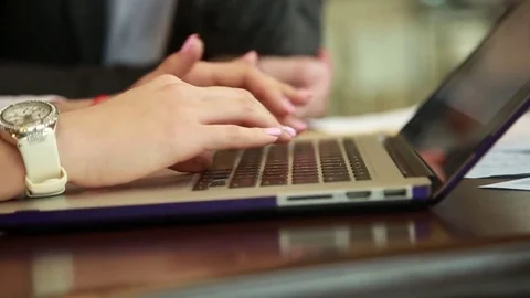 Close-up female hands using laptop Stock Footage 74304621