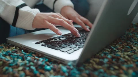 Close up of female hands using laptop computer at home. Stock Footage 100597231