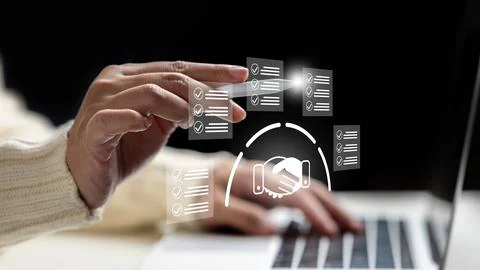 Close-up of female hands using a laptop and stylus with digital checklist a.. Stock-Fotos