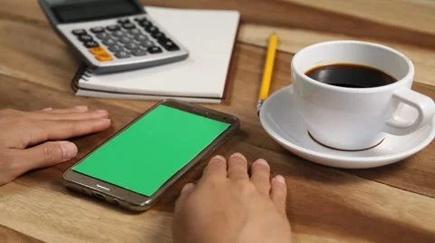 Close-up of female hands using a smart phone. chroma-key, green-screen Stock Footage 62365420