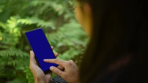 Close-up of female hands using a smart phone. chroma-key, green-screen Stock Footage 101866604