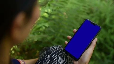 Close-up of female hands using a smart phone. chroma-key, green-screen Stock Footage 101869109