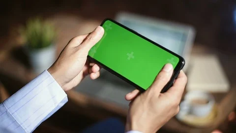 Close-up of female hands using a smart phone. chroma-key, green-screen Stock Footage 101943852