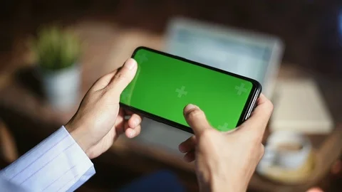 Close-up of female hands using a smart phone. chroma-key, green-screen Stock Footage 101944006
