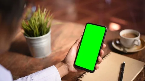 Close-up of female hands using a smart phone. chroma-key, green-screen Stock Footage 101944854