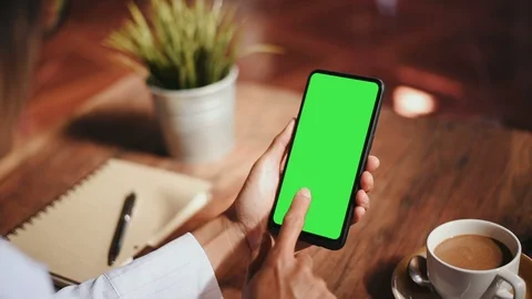 Close-up of female hands using a smart phone. chroma-key, green-screen Stock Footage 101945047