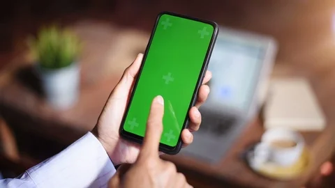 Close-up of female hands using a smart phone. chroma-key, green-screen Stock Footage 101946608