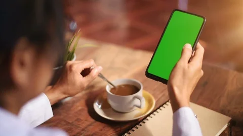 Close-up of female hands using a smart phone. chroma-key, green-screen Stock Footage 101946773