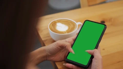 Close-up of female hands using a smart phone. chroma-key, green-screen Stock Footage 119925722