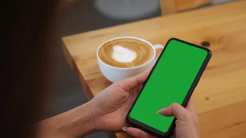 Close-up of female hands using a smart phone. chroma-key, green-screen Stock Footage 119926397