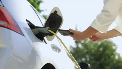 Close up of female hands using smart phone for remote control to charge the Stock Footage 200836172