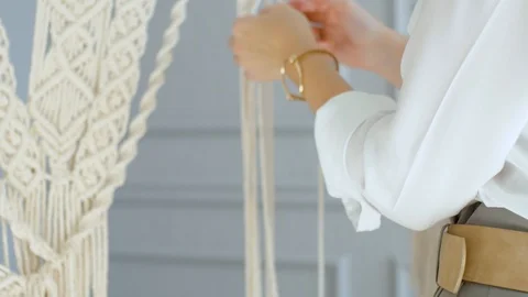 Close-up female hands weave macrame Video stock 120980953