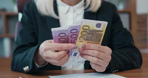 Close up of female hands which holding a lot of euros and doing calculation Stock Footage 203525836
