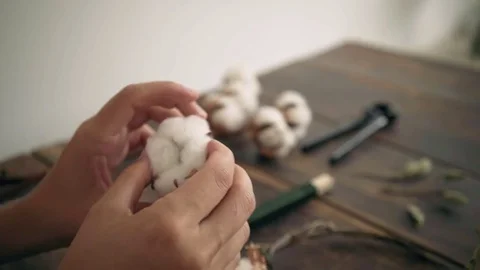 Close up of female hands work on cotton wreath Video stock 79359632