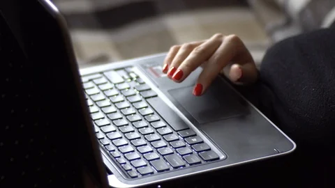 Close up of the female hands working and taping on the laptop computer. Stock Footage 88706182