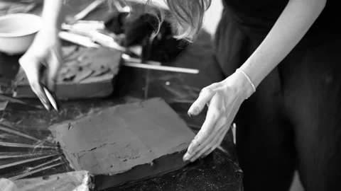 Close-up of female hands working with clay. Potter in the process of sculpting Stock Footage 157284068