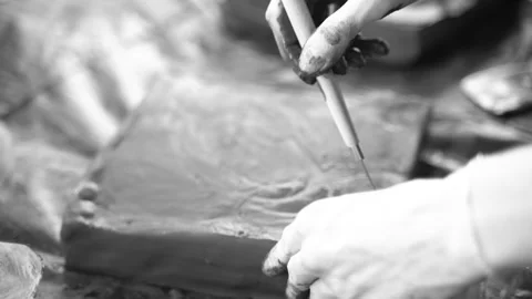 Close-up of female hands working with clay using tools. Potter in the process of Stock Footage 158809542