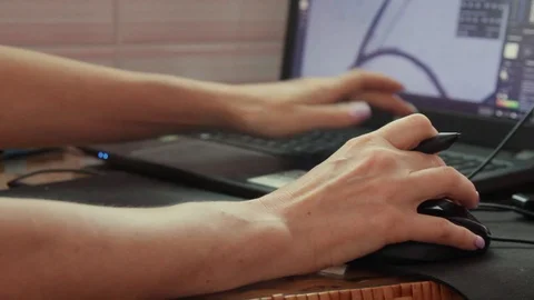 Close up of female hands working simultaneously with a mouse and stylus on a lap Stock Footage 119226721