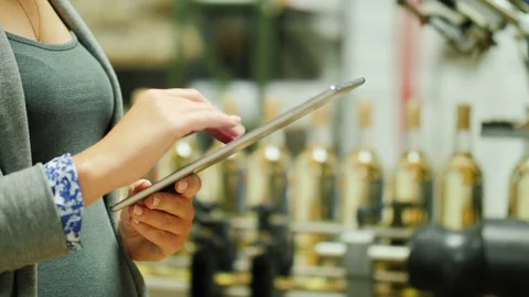 Close-up of female hands working with a tablet. Against the background of a Stock Footage 82795129