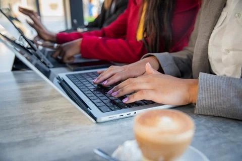 Close up of female hands working using laptops and tablets in the office, f.. Stock Photos