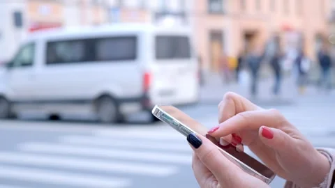 Close up of female hands writing a message on a smartphone in the summer on the Stock Footage 276257904
