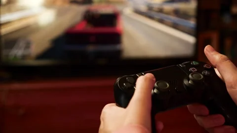 Close-up of female holding a controller and playing video game. Stock Footage 132618855