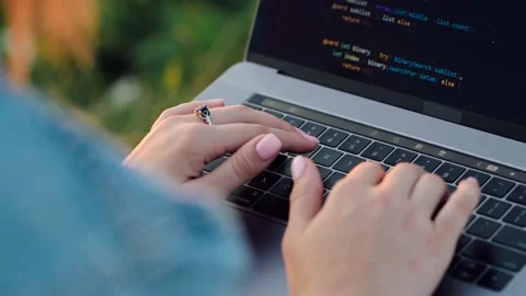 Close up female IT Programer works on a hill on the background of the city Stock Footage 159377910