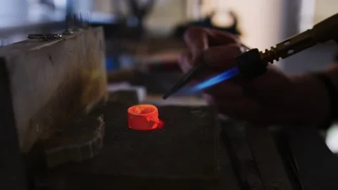 Close Up Of Female Jeweller Working On Ring In Studio Using Blowtorch Stock Footage