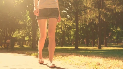 Close up female legs in sunlight Stock Footage 127866329