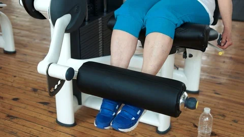 Close up female legs on weight lifting machine. Stock Footage