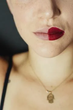 Close up of female lips with two different lipsticks Foto stock