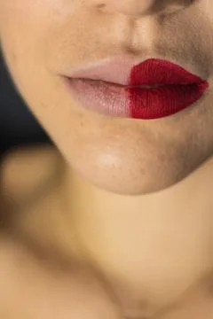 Close up of female lips with two different lipsticks Stock Photos