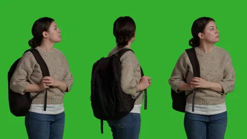 Close up of female model carrying backpack over greenscreen backdrop Stock Footage 227045934