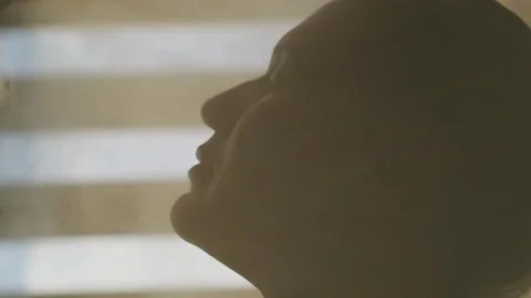 Close-up female profile in a stream of water vapor. Video stock 261785166