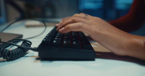 Close-up female programmer typing coding on keyboard working late in office. Vídeos de archivo 347148453