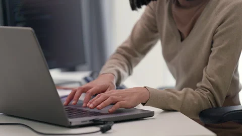 Close-up of a female programmer's hands typing on a mechanical keyboard in a  Stock-Footage 310589226