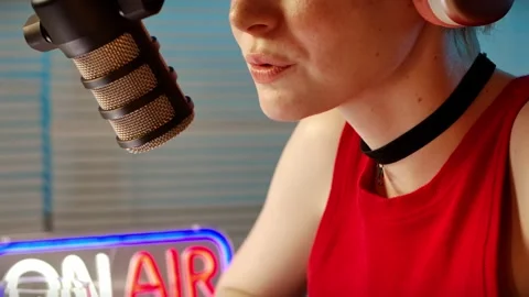 Close-up of Female Radio Host Using Microphone for Podcast Recording Stock Footage 312271806