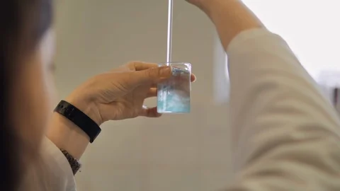 Close up of female scientist doing laboratory experiment. Stock Footage 128456099