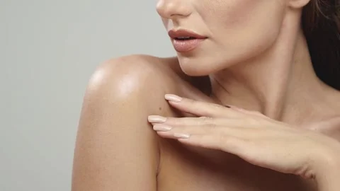 Close-up of female sensually touching her shoulders Stock Footage 146234521