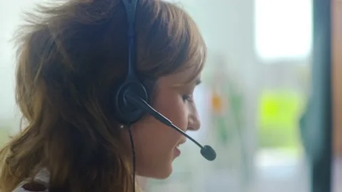 Close up of female service phone operator focus on sales agent woman in headset Stock Footage 146977413