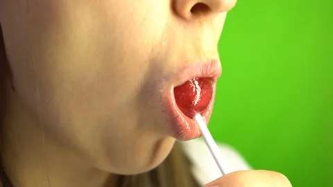 Check out wet glossed soft lips sucking a lollipop